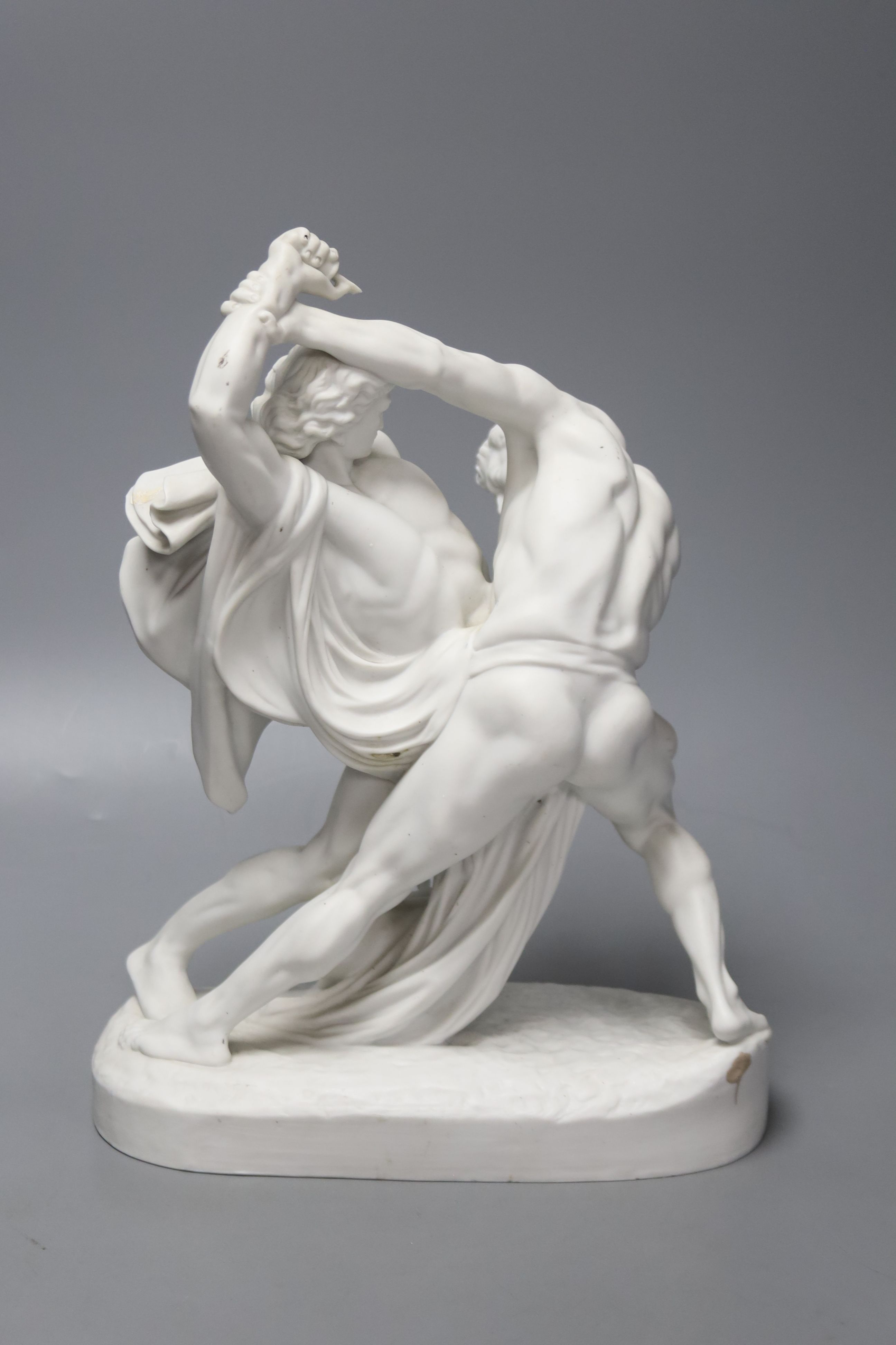 A 19th century Continental bisque porcelain figure group, males in combat, 30cm high